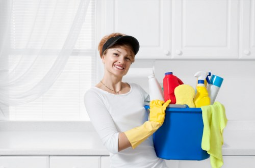 Local technician assessing a stain on upholstery in Queens Park