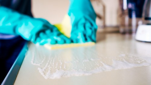 Technician preparing mattress deep cleaning equipment in Queens Park